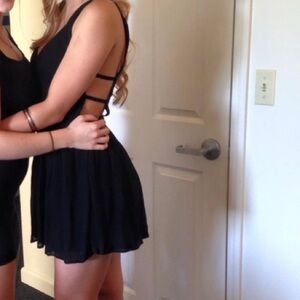 Black mini dress with lace grid open back